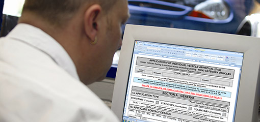 Man at computer screem completing an online IVA application