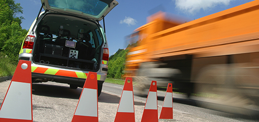 Mobile ANPR facility on roadside with speeding lorry passing by