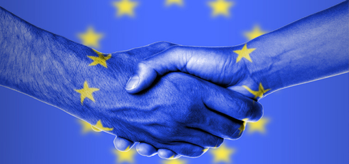 Shaking hands with EU flag behind