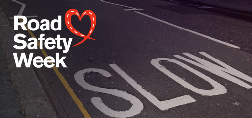 Slow road marking with Road Safety Week logo