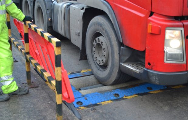 A lorry undergoing a roller brake test