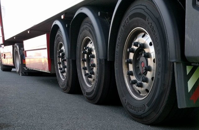 Wheels on a lorry shot from a low angle.