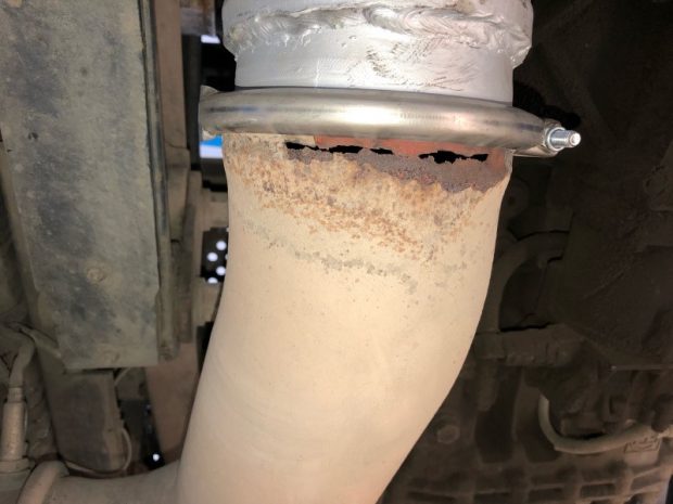 a corroded exhaust joint with new section