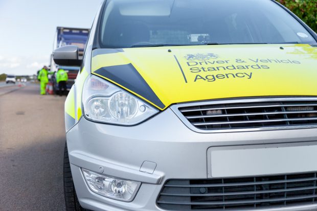 DVSA enforcement car with lorry in view in lay by