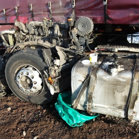 Damaged lorry tank with spillage issue