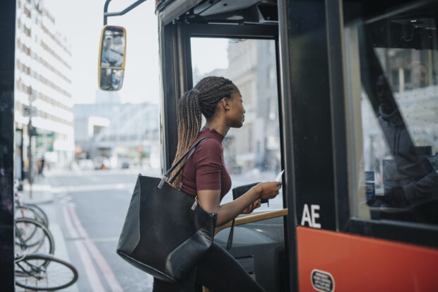 Woman getting on a bus